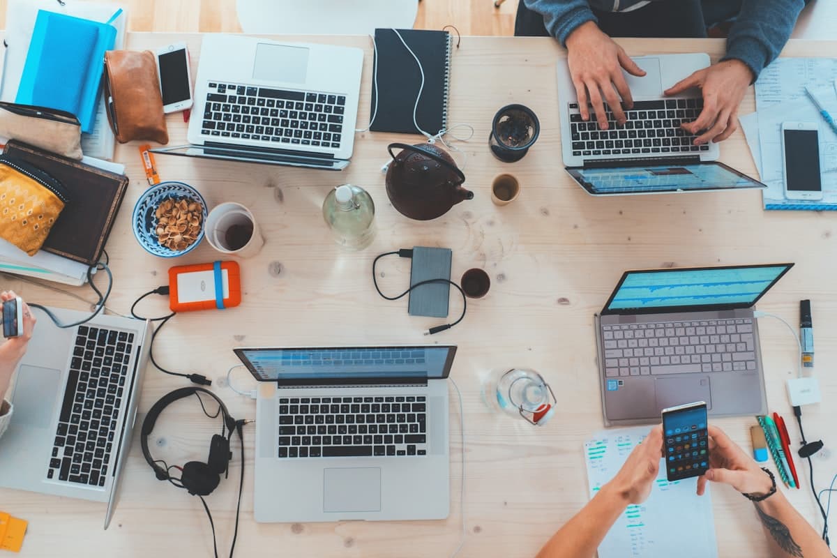 Product team working at laptops in a shared workspace